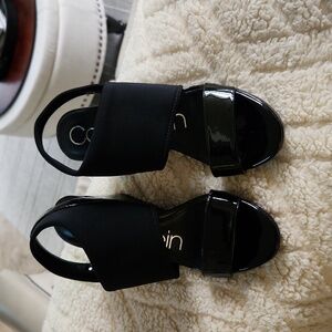 Shoes Calvin Klein.  Patent around open toe.  Fits 6 1/2 narrow.  I am 6 1/2-7